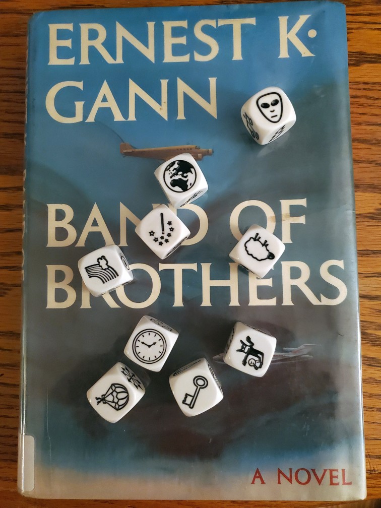 Saturday story cubes roll on top of Ernest K. Gann's "Band of Brothers"