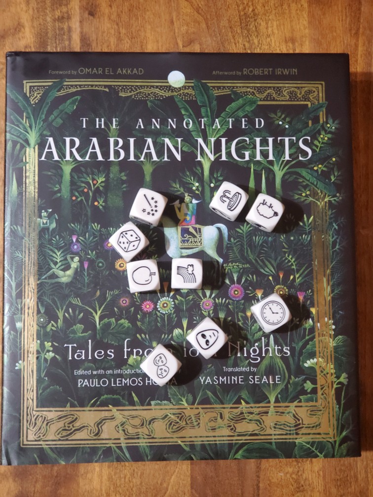 Story Cubes roll on top of Yasmine Seale's translation of "The Annotated Arabian Nights"