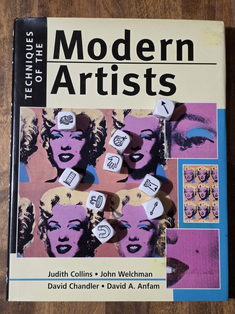 Story Cubes roll on top of Techniques of the Modern Artists by Collins, et al.