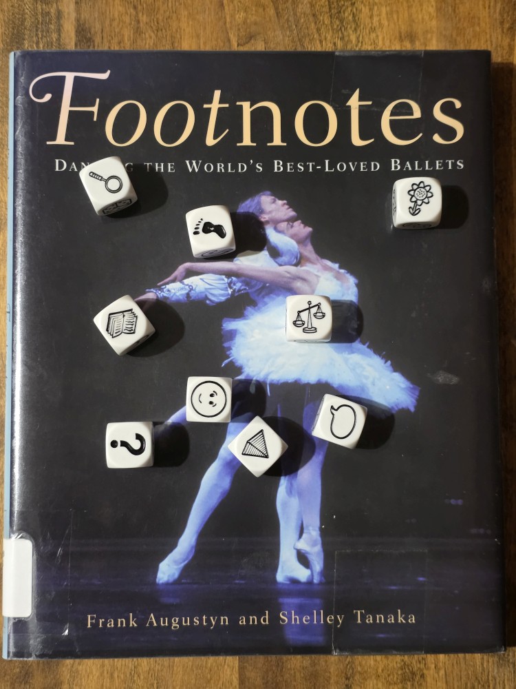 Story Cubes roll on top of Footnotes: Dancing the World's Best-Loved Ballets by Frank Augustyn and Shelley Tanaka